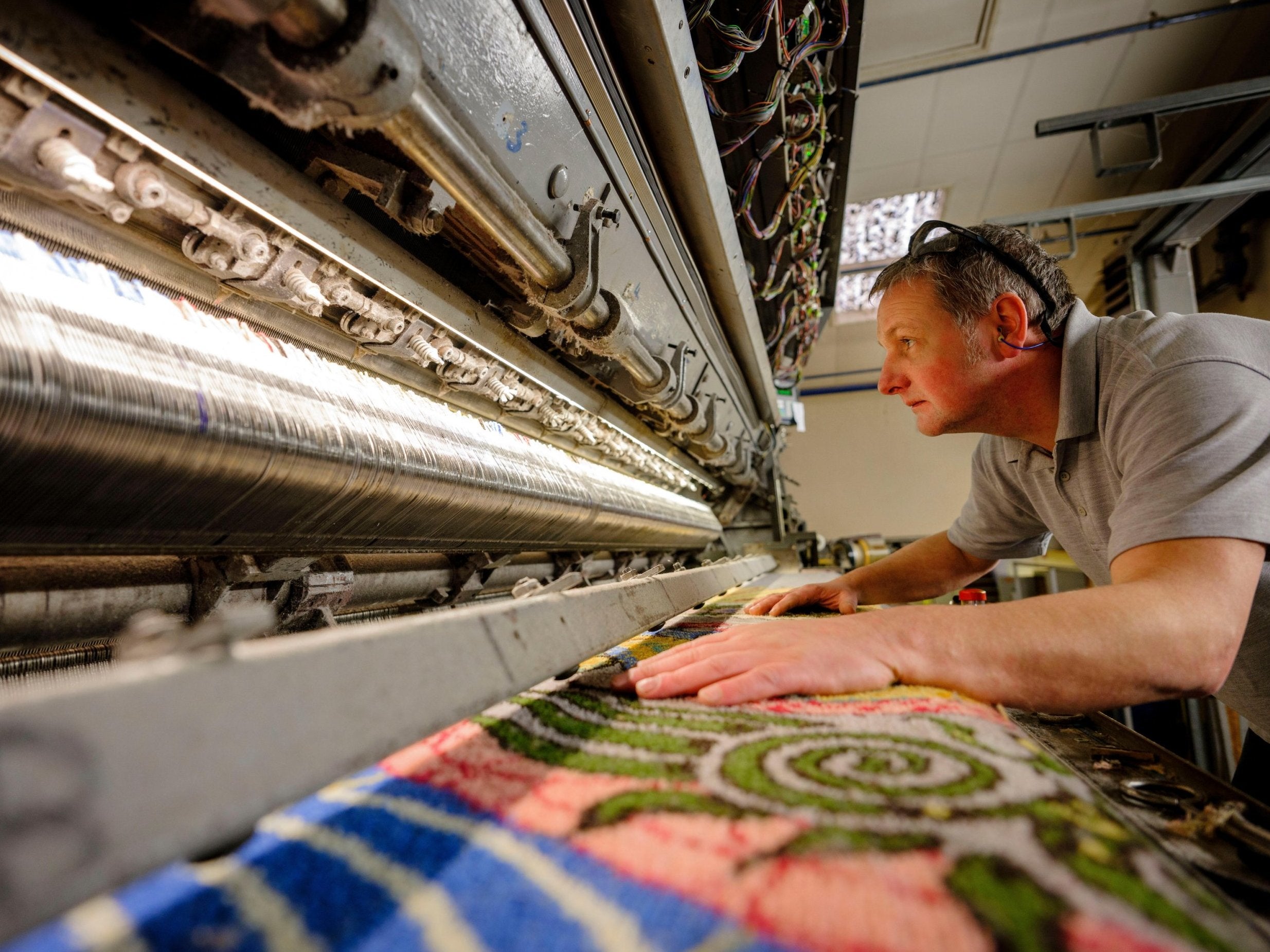 A worker makes progress on the carpet for Brighton’s pavilion