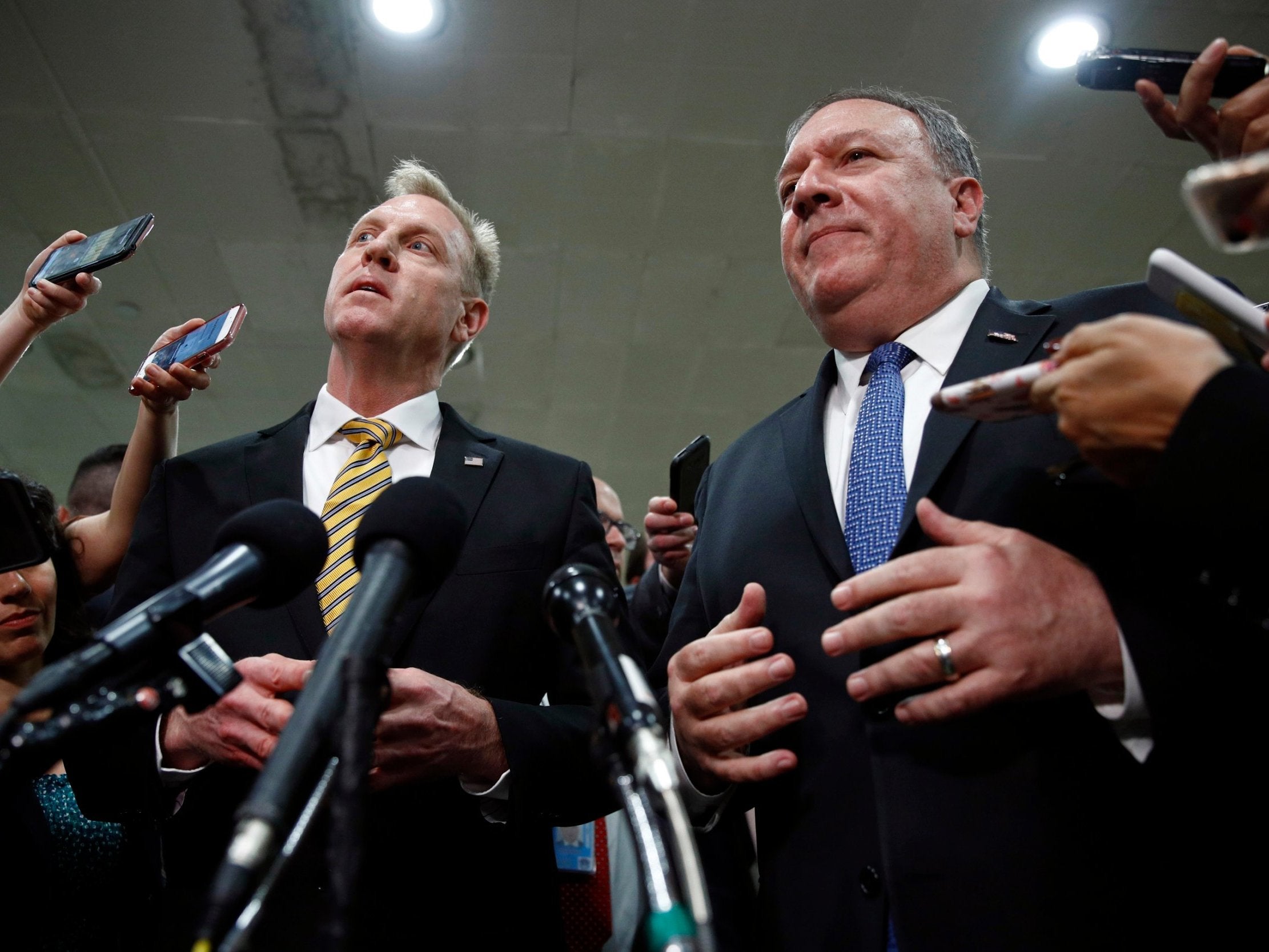 Patrick Shanahan, left, and Mike Pompeo speak after a classified briefing for members of Congress on Iran