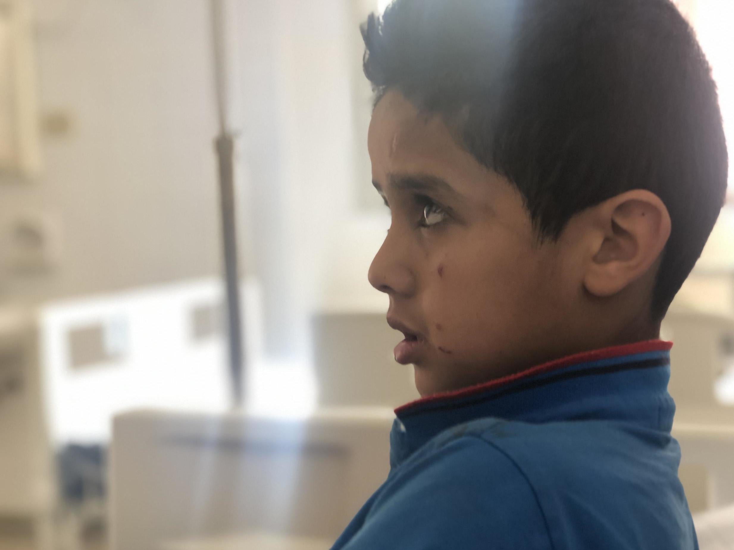 ‘All I heard was the sound of this missile,’ recalls Mohamed, nine, who is now an orphan. ‘I covered up my brother to protect him because he is smaller than me’ (Borzou Daragahi)