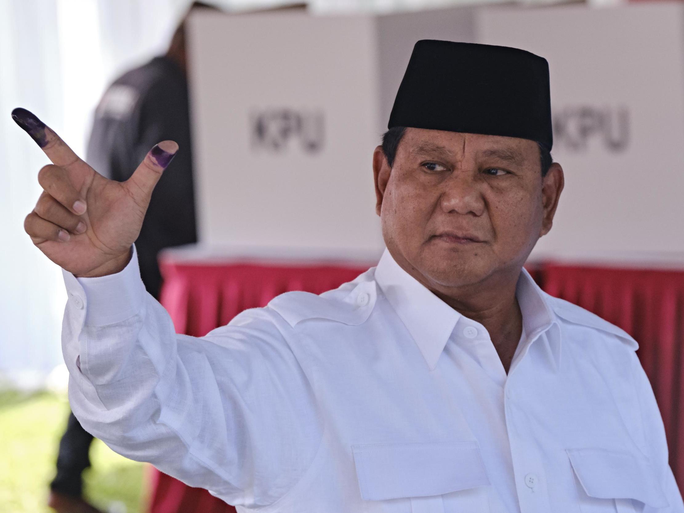 Prabowo Subianto (pictured at polling station showing ink-stained fingers) is set to challenge election result in court