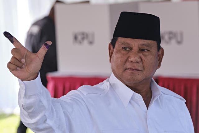 Prabowo Subianto (pictured at polling station showing ink-stained fingers) is set to challenge election result in court