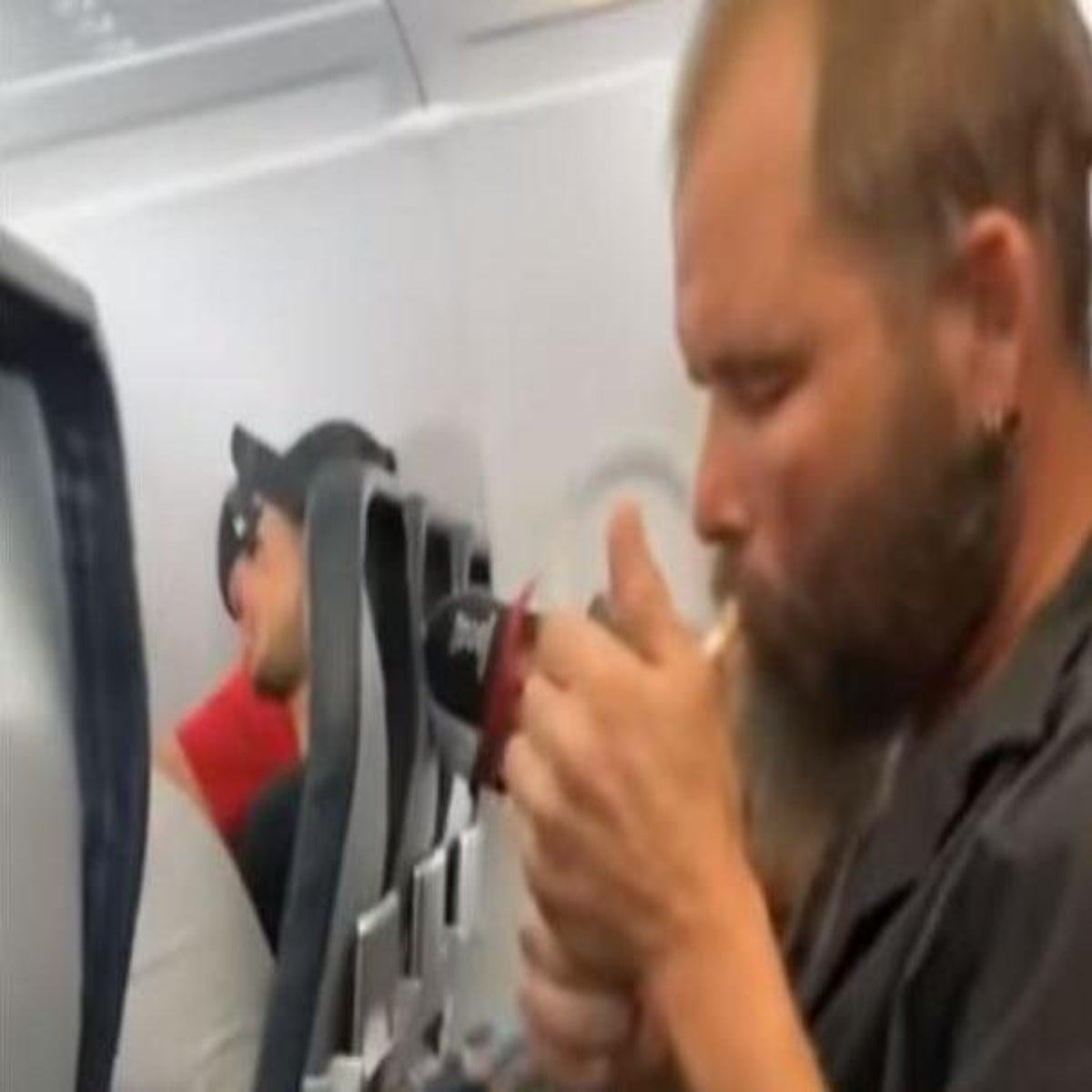 Man lights cigarette and starts smoking onboard flight in US | The  Independent