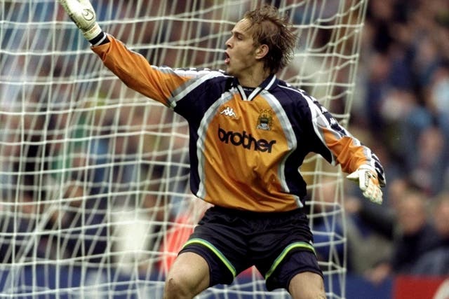 Manchester City goalkeeper Nicky Weaver celebrates his decisive shoot-out save