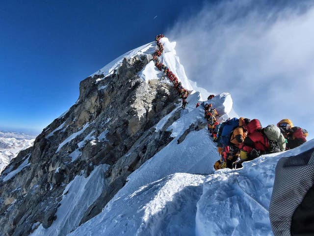 Climbers lining up to stand at the summit of Mount Everest on Wednesday, when teams had to queue for hours to reach the summit