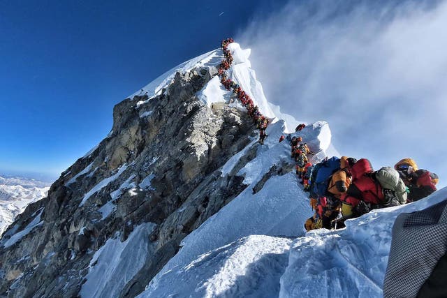 Climbers lining up to stand at the summit of Mount Everest on Wednesday, when teams had to queue for hours to reach the summit