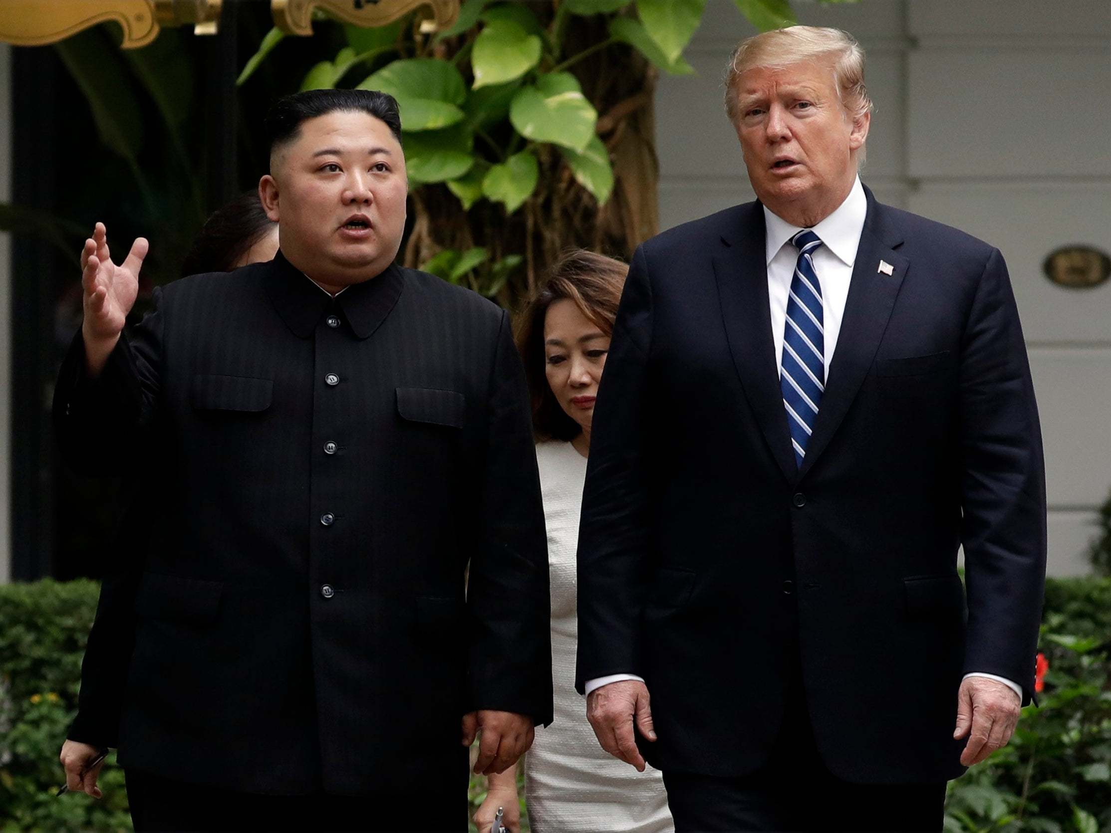 Donald Trump and Kim Jong-un take a walk after their first meeting at a Hanoi hotel