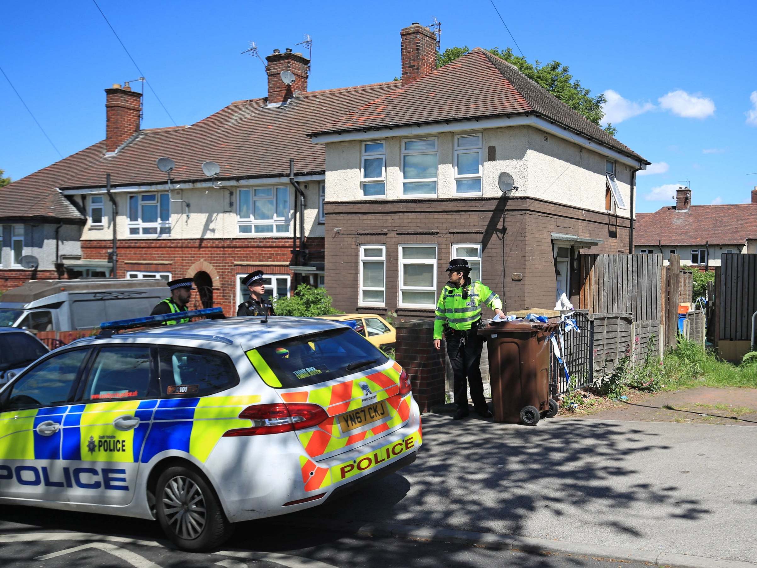 Police officers at a property in Shiregreen, Sheffield, after two teenage boys died and four children were taken to hospital