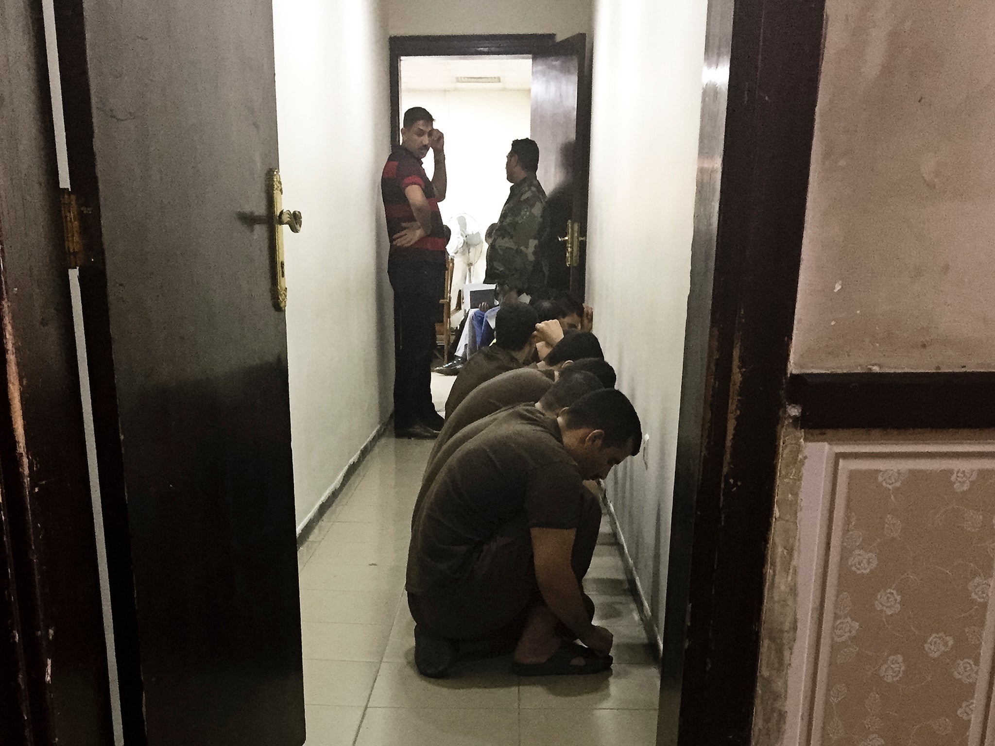 Suspected Isis militants wait their turn for sentencing at the counterterrorism court in Baghdad, Iraq