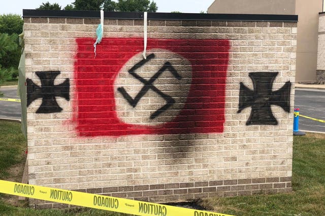 Nolan Brewer pleaded guilty to conspiring to violate civil rights after painting swastikas and iron crosses on the synagogue