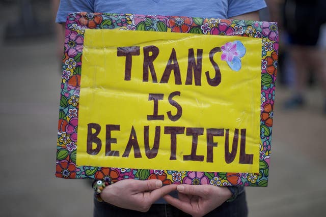 Protestors demonstrate during a rally against the transgender bathroom rights repeal at Thomas Paine Plaza 15 February 2017 in Philadelphia, Pennsylvania