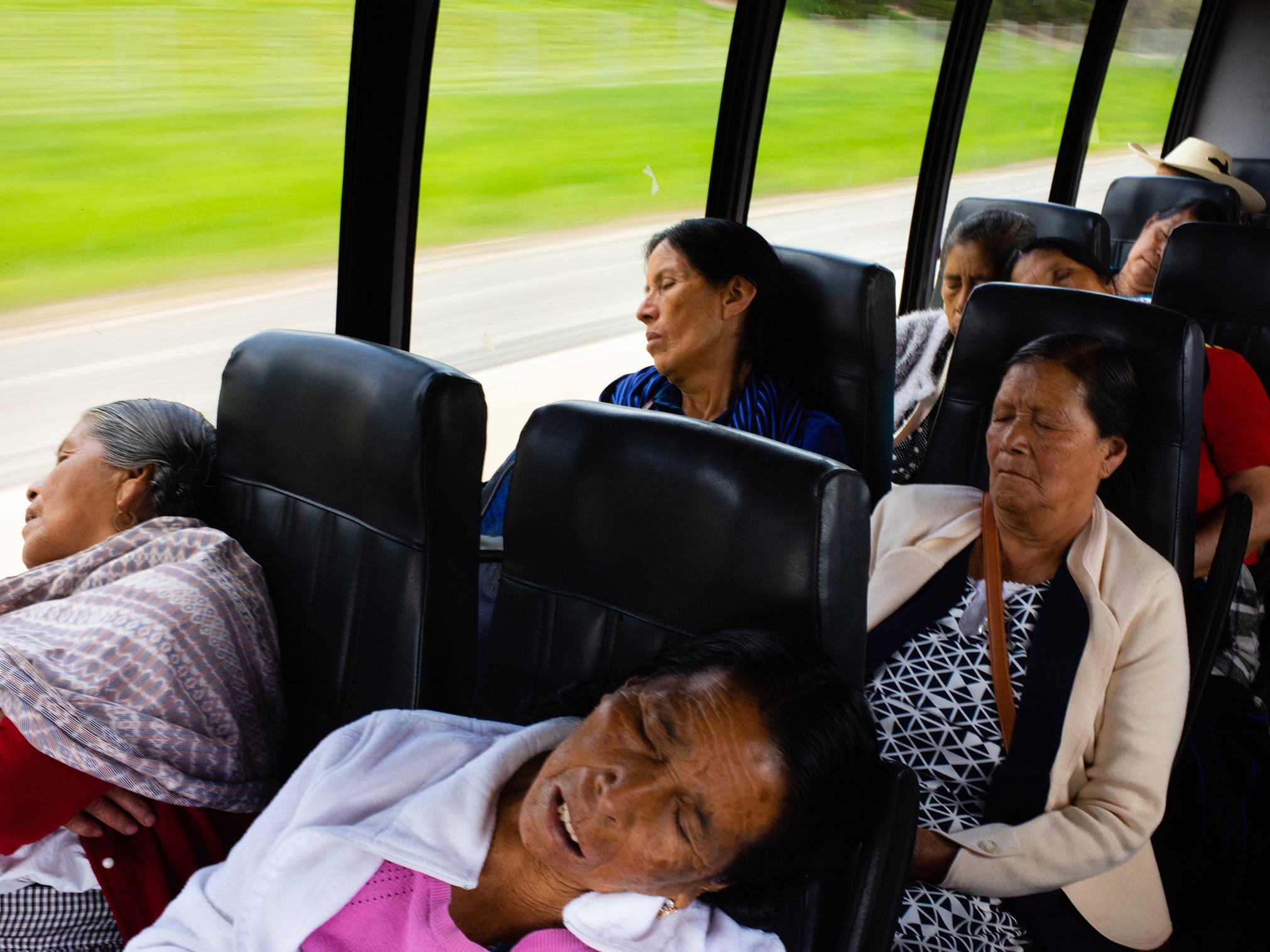 Romero Leon (top left) and her fellow palomas sleep on the bus after a long night of travel from Michoacan state in Mexico to Illinois