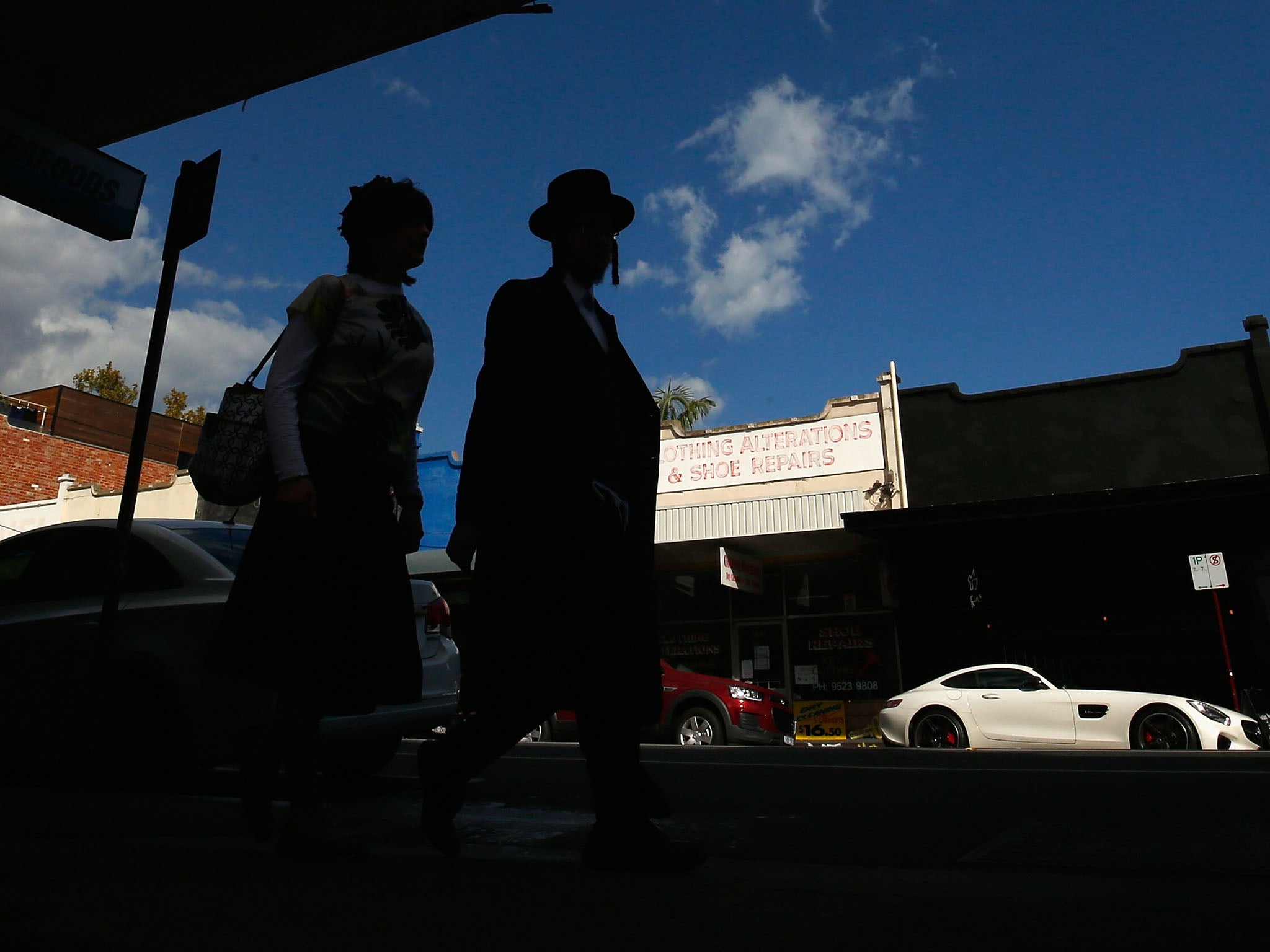 An Orthodox Jewish couple walk along Glen Eira road in Ripponlea, Melbourne. The city is home to the second-largest Jewish community in Australia