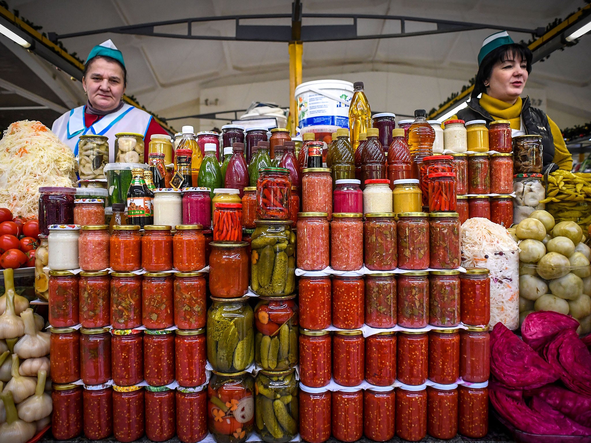 Traders sell pickles at a market in Moscow – food prices shot up after sanctions were imposed in 2014 (AFP/Getty)