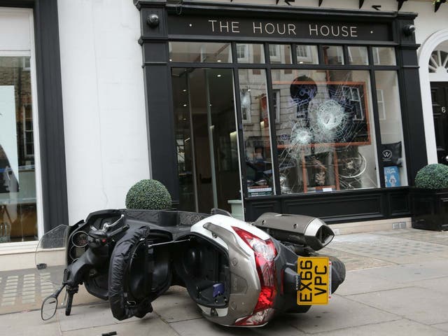 A moped outside The Hour House on Duke Street, Westminster, where armed robbers targeted the luxury watch shop