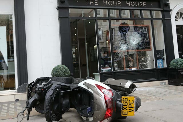 A moped outside The Hour House on Duke Street, Westminster, where armed robbers targeted the luxury watch shop