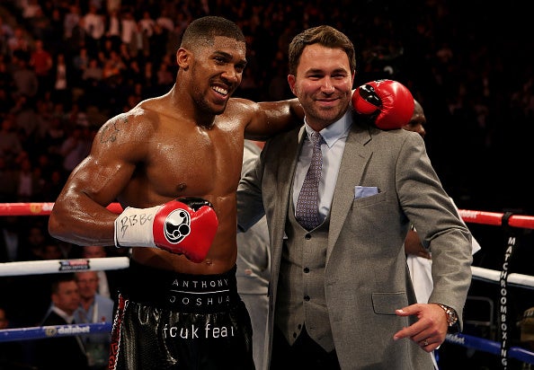 Eddie Hearn celebrates with Anthony Joshua