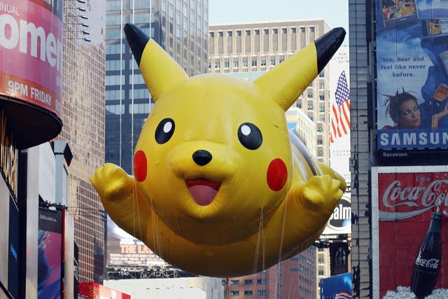 The "Pikachu" balloon sponsored by The Pokemon Company floats down Broadway during the 75th Macy's Thanksgiving Day Parade 22 November 2001 in New York
