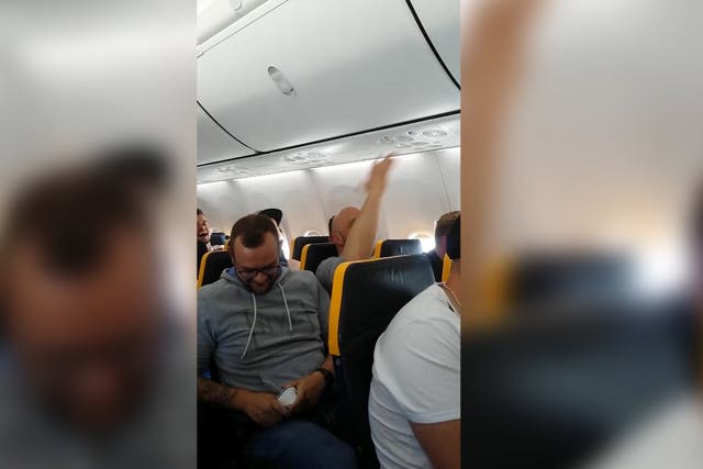 Footage captured by passenger Elisa Zenck shows a group of men making racist slurs