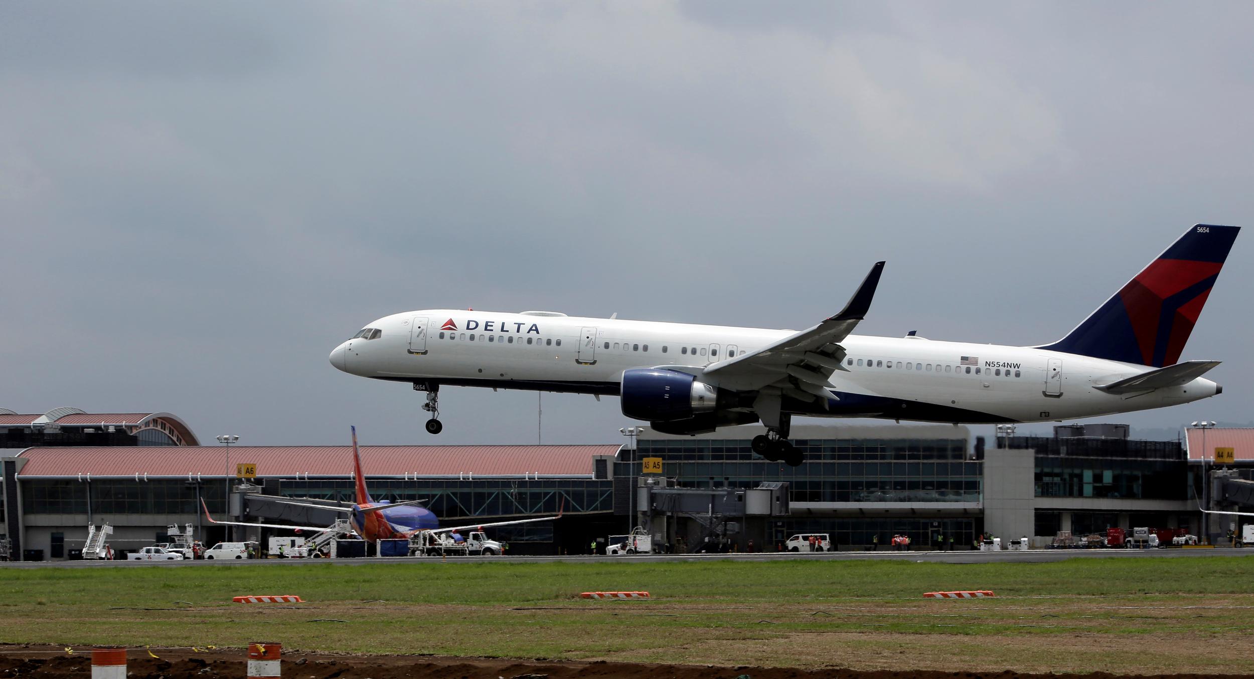 Delta airlines flight makes emergency landing after broken plane part flies into engine after takeoff