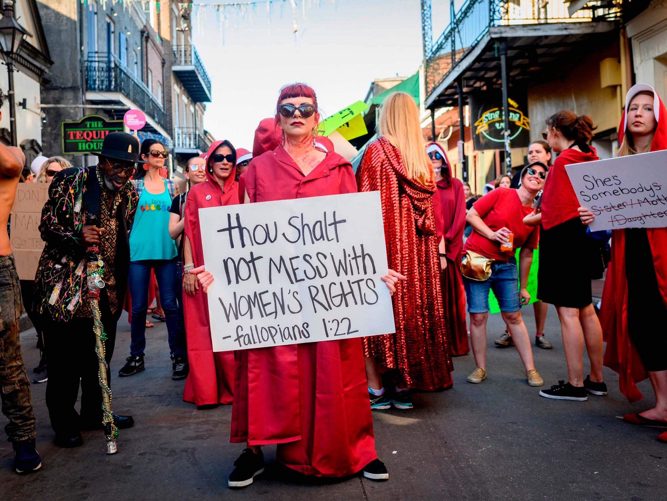 Handmaid-themed protesters march in the French Quarter of New Orleans, Louisiana, to protest the proposed "heartbeat bill" that bans abortion after six weeks in that state.