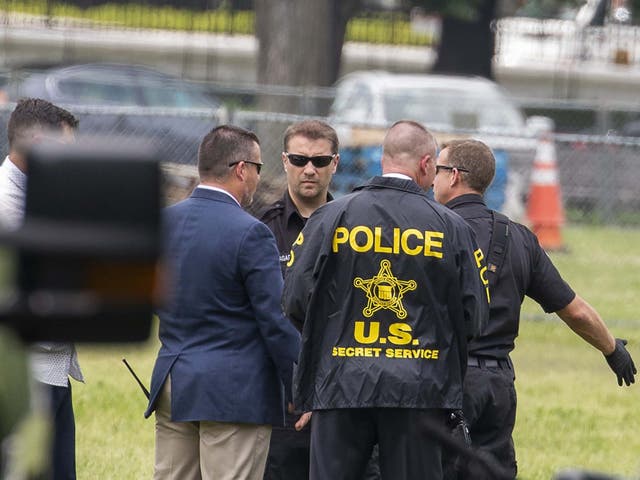 Law enforcement at the scene where a man set himself on fire on the Ellipse near the White House in Washington, DC, on 29 May 2019.