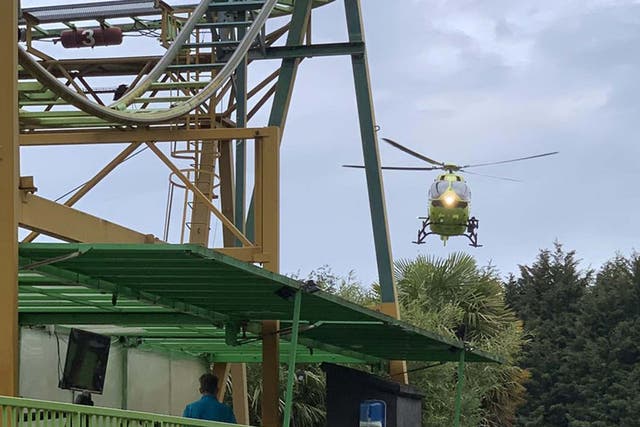 An air ambulance arrives to attend to a boy who fell from a rollercoaster at Lightwater Valley theme park