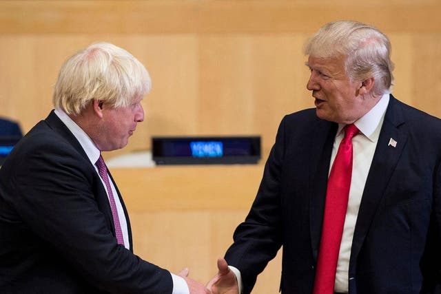 British Foreign Secretary Boris Johnson and US President Donald Trump greet before a meeting on United Nations Reform at UN headquarters in New York on September 18, 2017