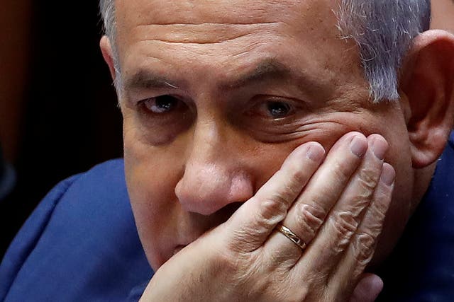 Israeli Prime Minister Benjamin Netanyahu sits at the plenum at the Knesset, Israel's parliament, in Jerusalem