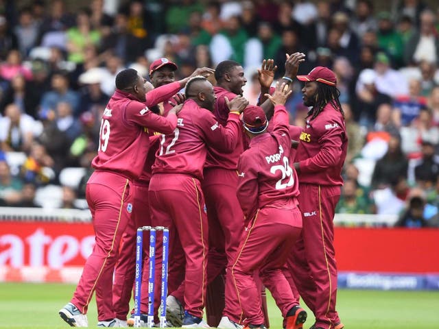 West Indies celebrate Jason Holder taking a wicket en route to victory