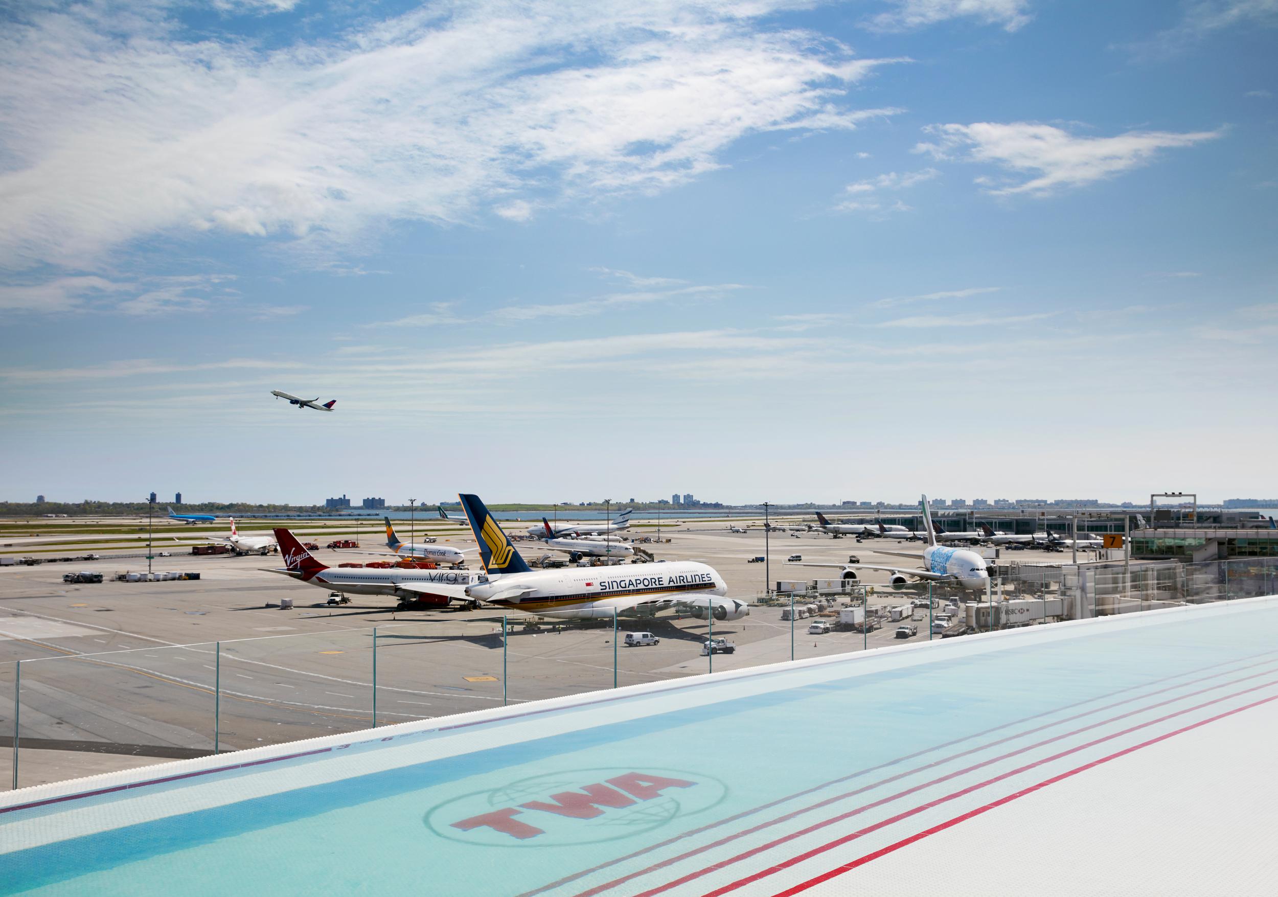 The rooftop pool, which overlooks the runway