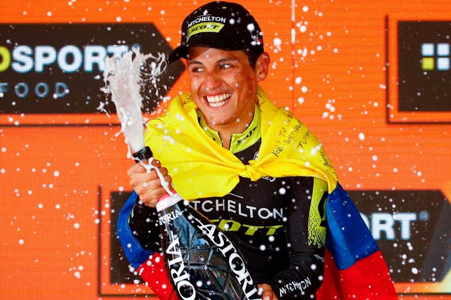 Esteban Chaves sprays champagne as he celebrates on the podium