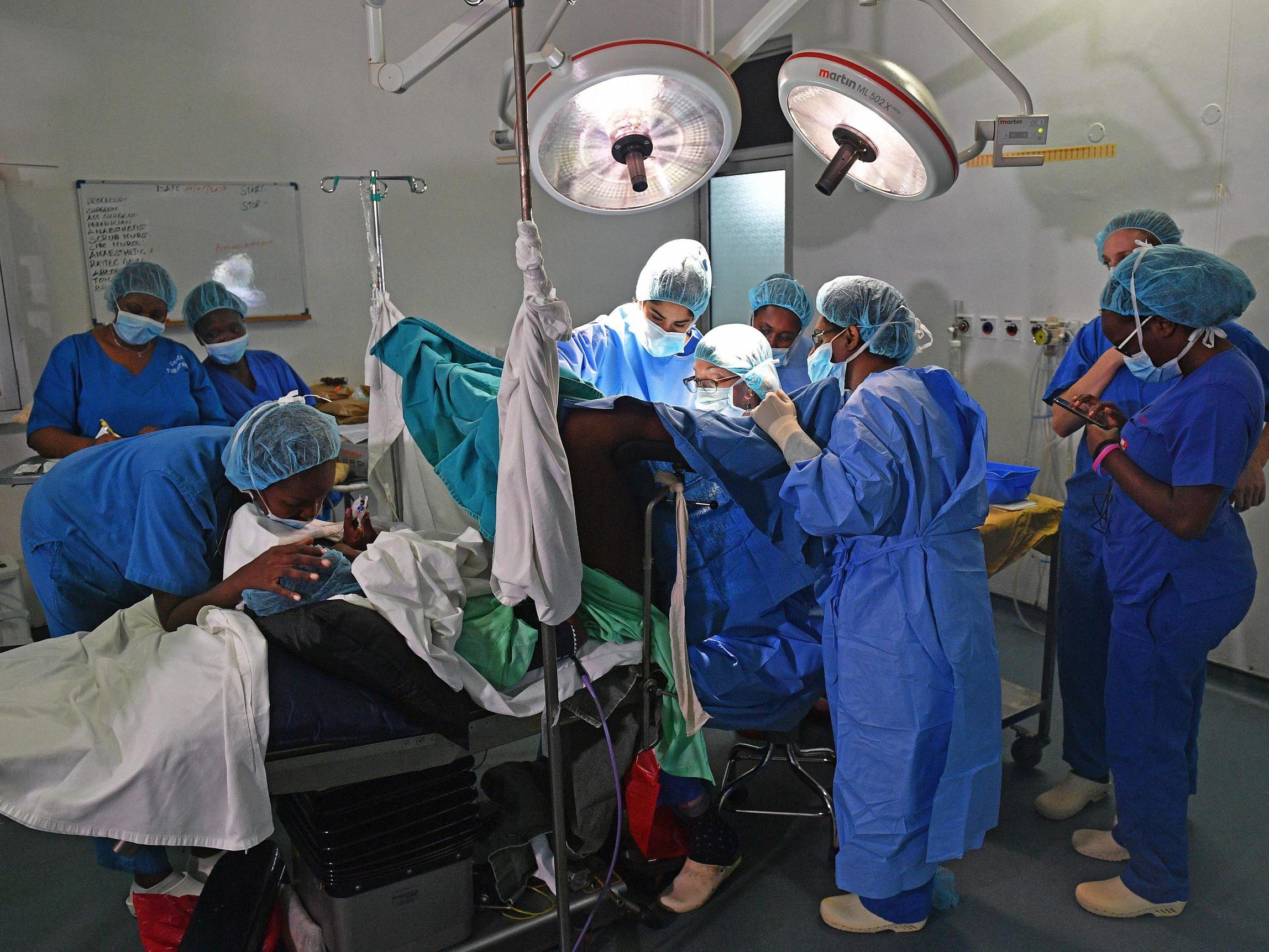 Gynecological surgeon Dr Marci Bowers begins the process of clitoral restoration on a patient in Nairobi in 2017