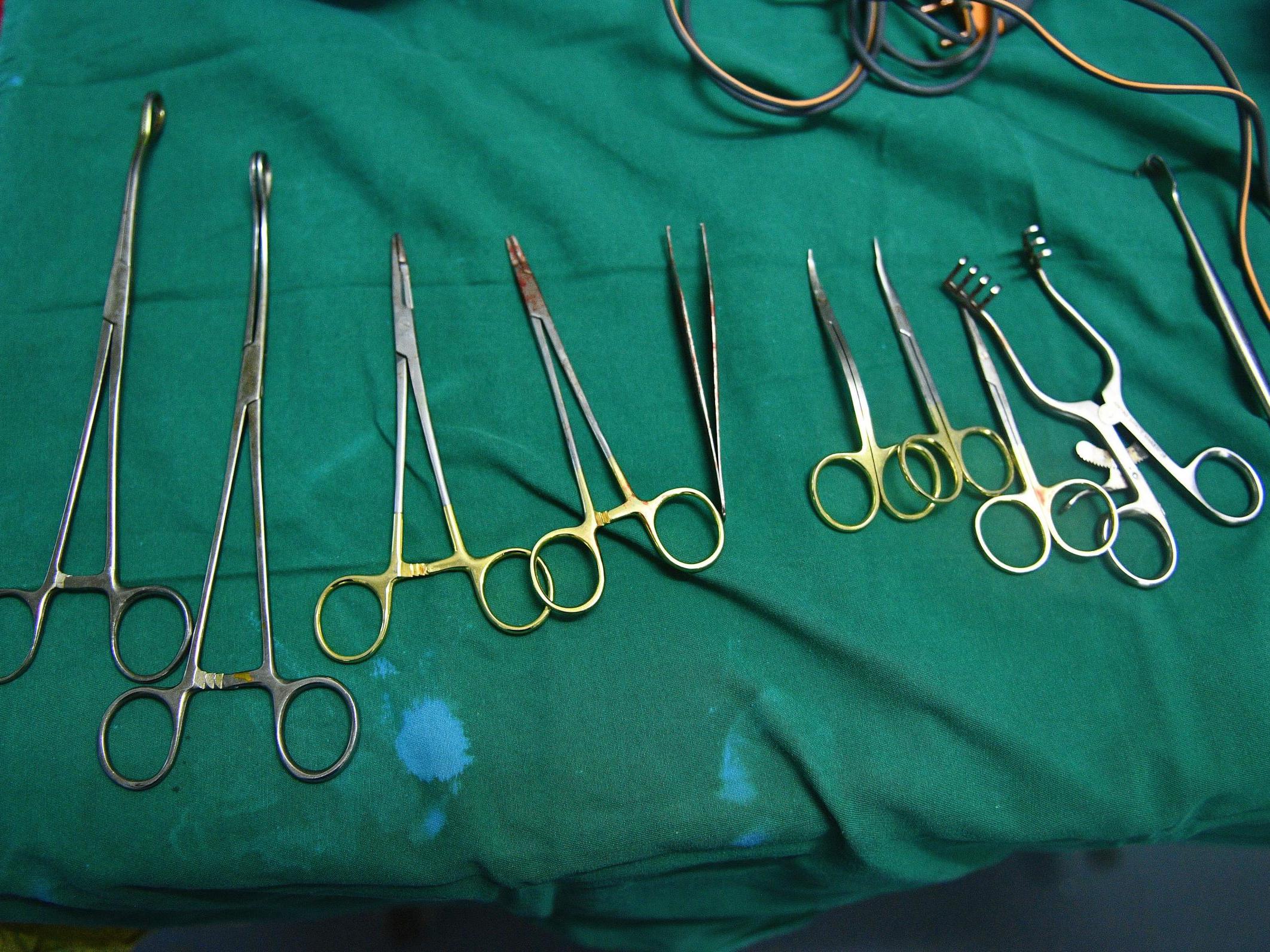 A man has been accused of tricking his daughters into getting FGM