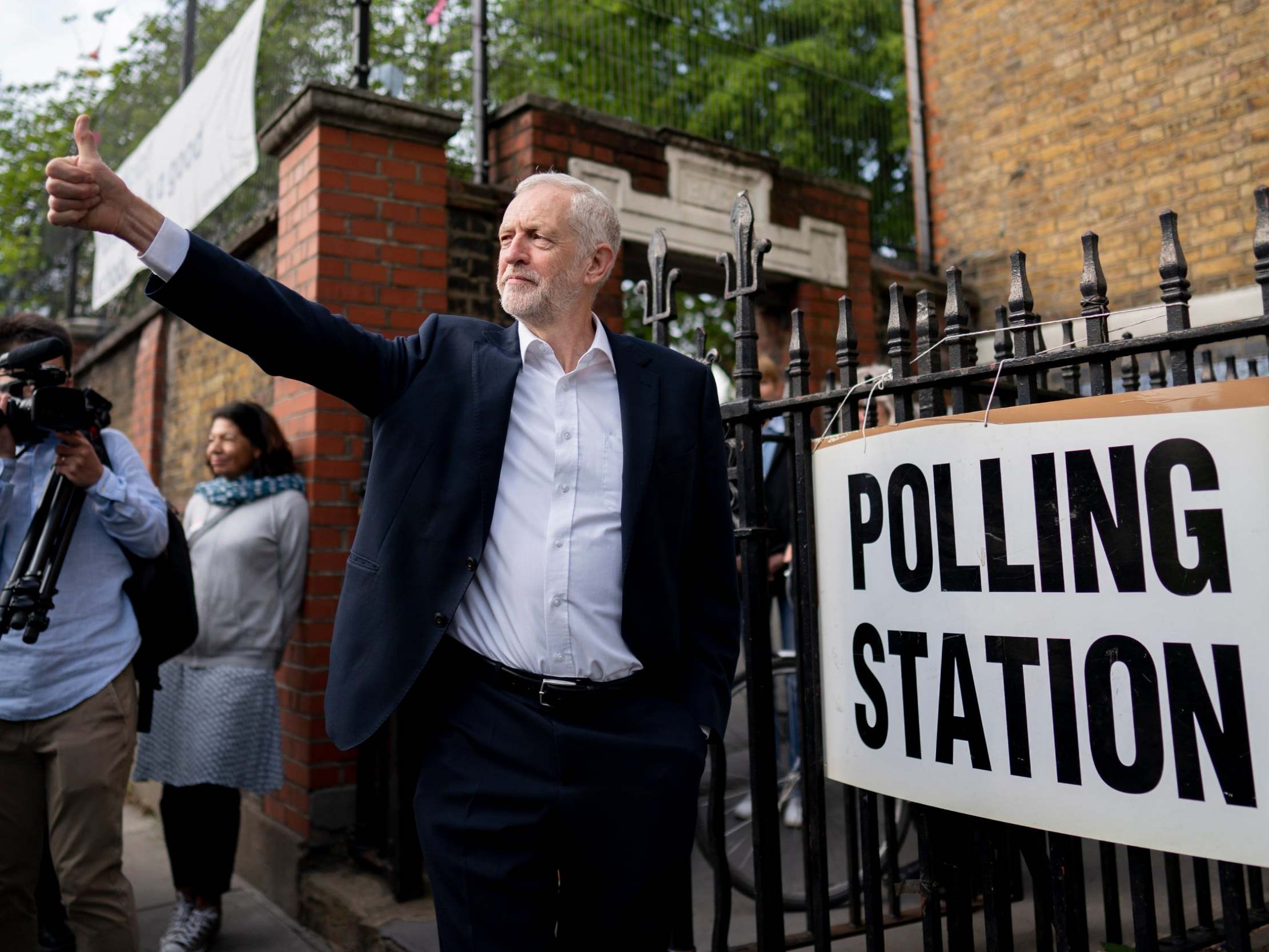 Corbyn leaves a polling station after voting in the EU elections