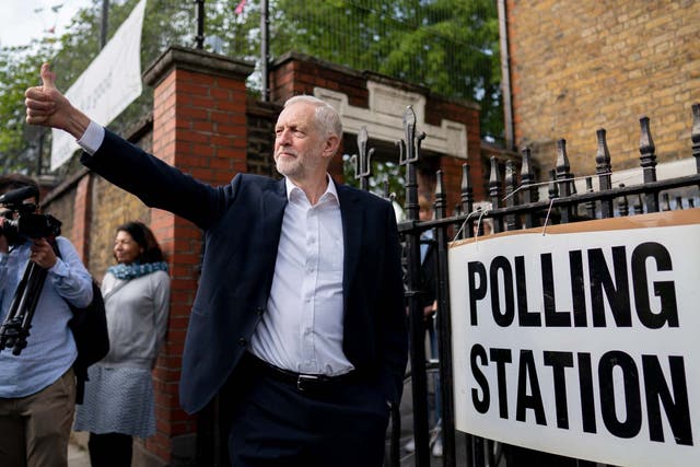 Corbyn leaves a polling station after voting in the EU elections
