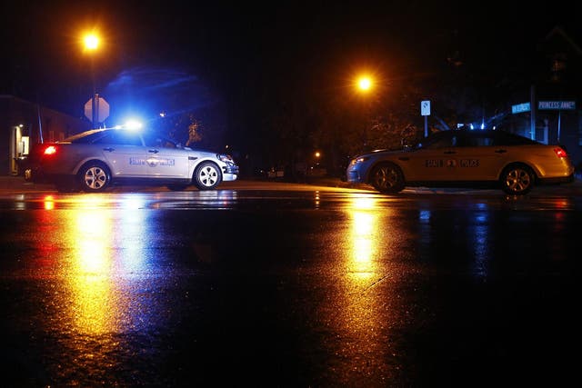 Virginia State Police vehicles block a street near the scene of a shooting at a municipal building in Virginia Beach early on Saturday, 1 June  2019. A longtime city employee opened fire at a municipal building in Virginia Beach on Friday, killing several people.