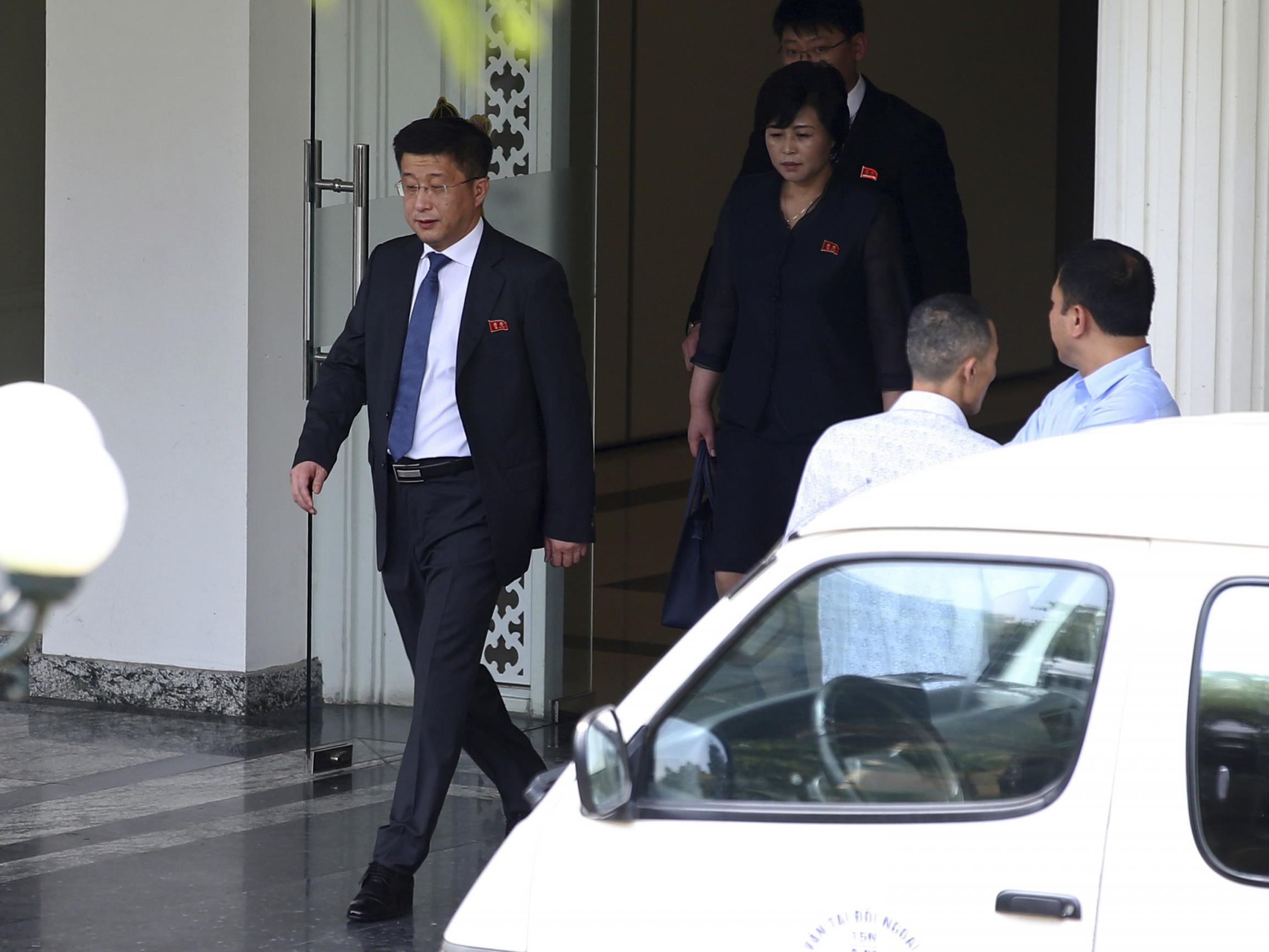 In this 21 February 2019 photo, Kim Hyok-Chol, left, North Korea's special representative for US affairs, leaves the Government Guest House in Hanoi, Vietnam. A South Korean newspaper is reporting that North Korea executed a senior envoy involved in nuclear negotiations with the US as well as four other high-level officials.
