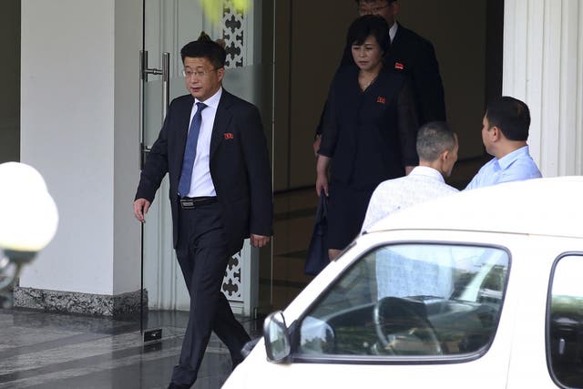 In this 21 February 2019 photo, Kim Hyok-Chol, left, North Korea's special representative for US affairs, leaves the Government Guest House in Hanoi, Vietnam. A South Korean newspaper is reporting that North Korea executed a senior envoy involved in nuclear negotiations with the US as well as four other high-level officials.