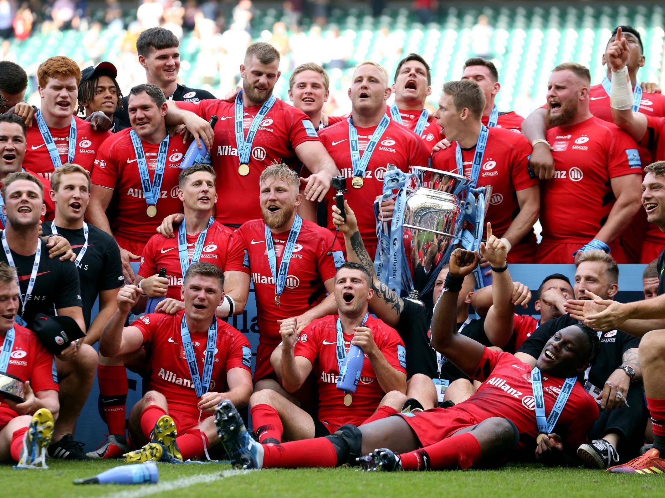 Saracens celebrate with the Premiership trophy