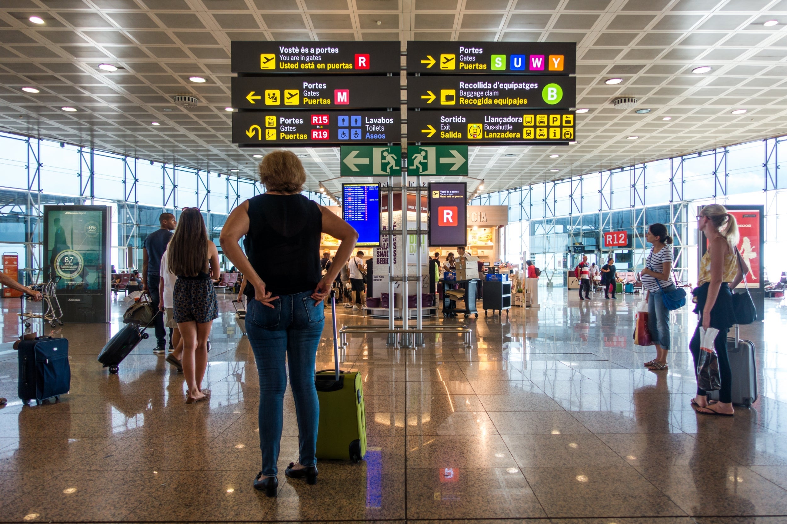 Passengers at the terminal of Barcelona El Prat airport