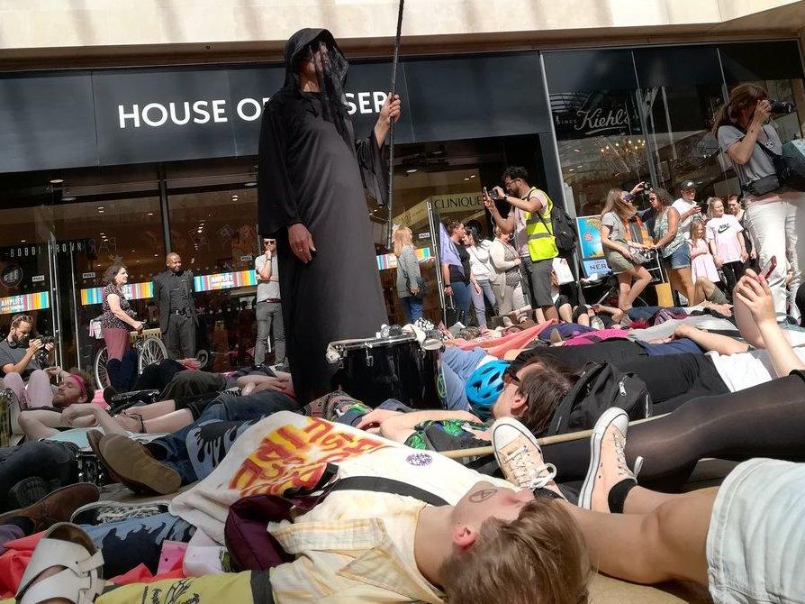 Extinction Rebellion protesters stage 'die-in' at Cabot Circus shopping area