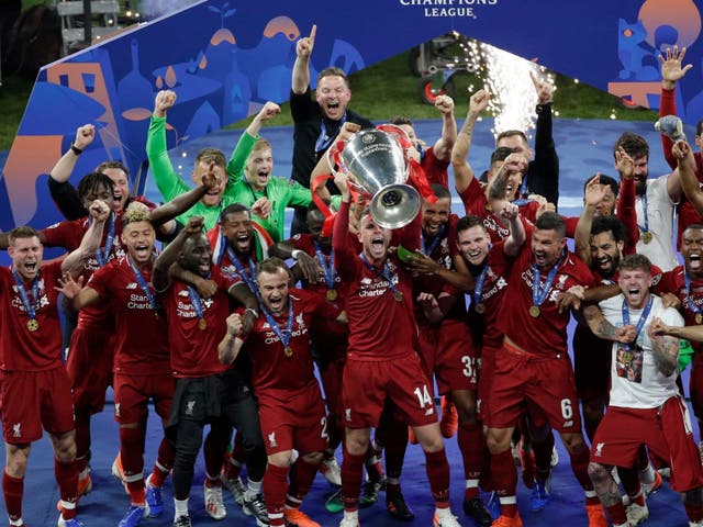 Jordan Henderson lifts the Champions League trophy after Liverpool's 2-0 victory over Tottenham