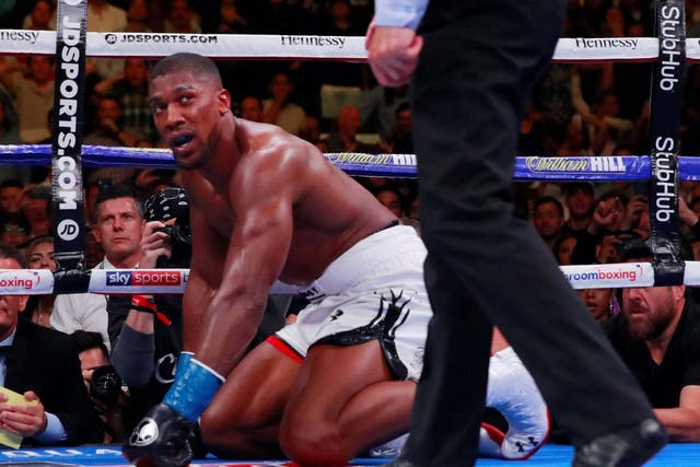 Anthony Joshua looks on after being knocked down by Andy Ruiz