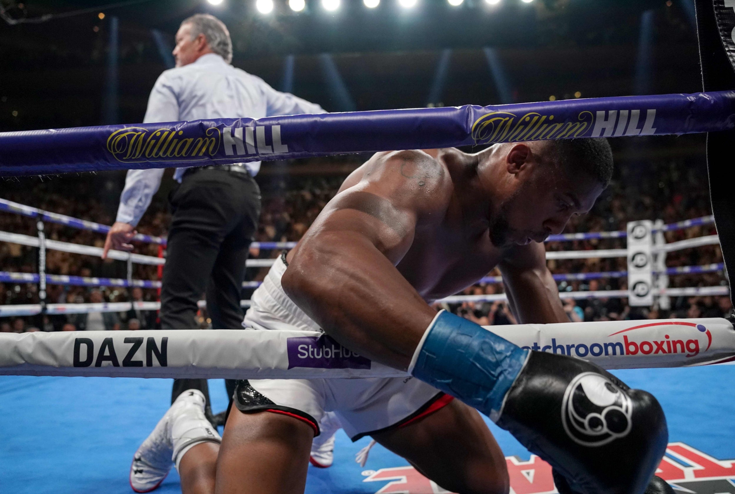 Joshua is knocked down by Ruiz in their bout at Madison Square Garden (AFP/Getty)