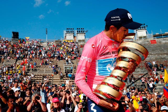 Richard Carapaz celebrates with the Giro d’Italia trophy