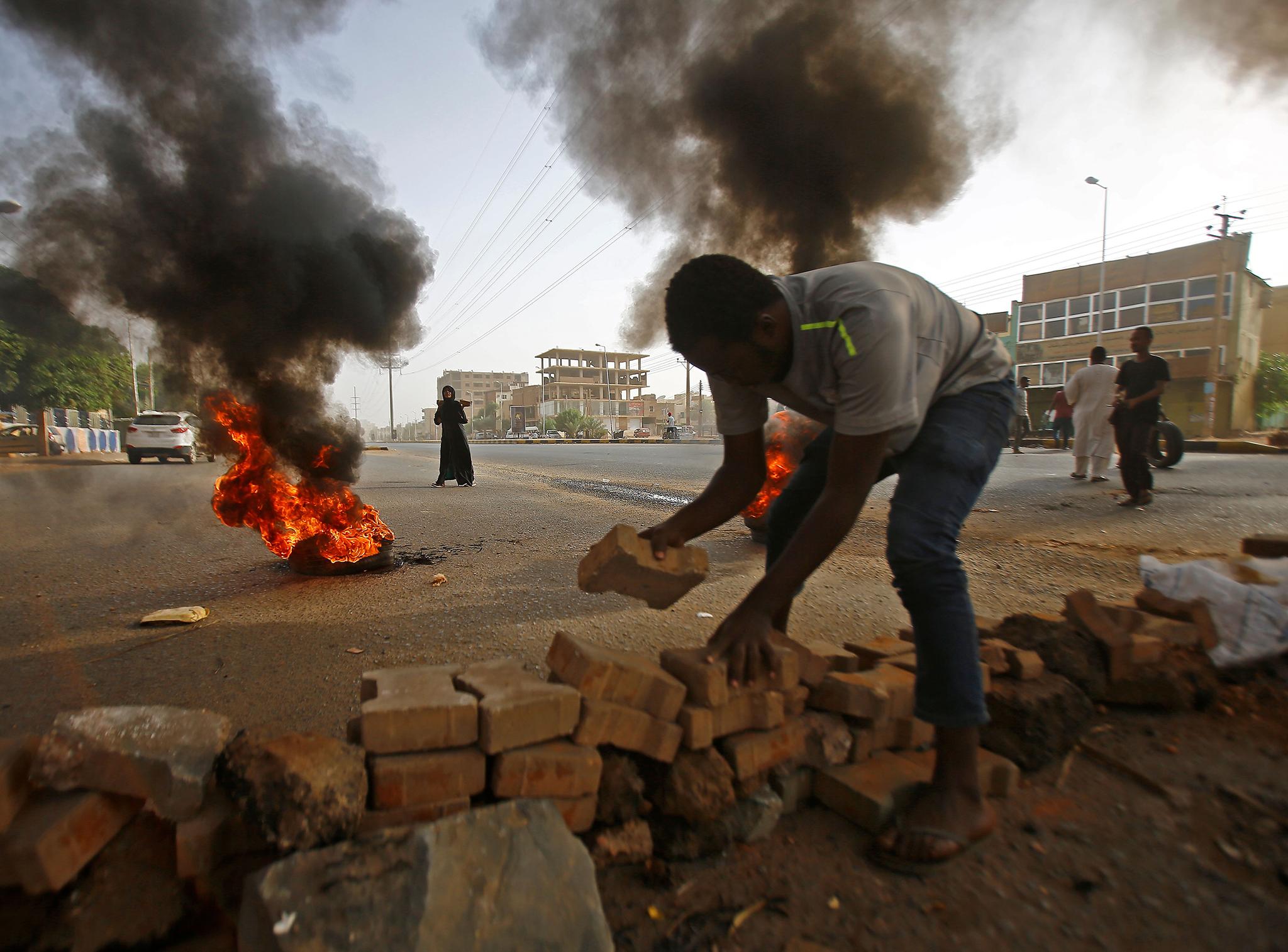 Dozens were killed as Sudan's military council tried to break up a sit-in outside Khartoum's army headquarters, a doctors' committee said.