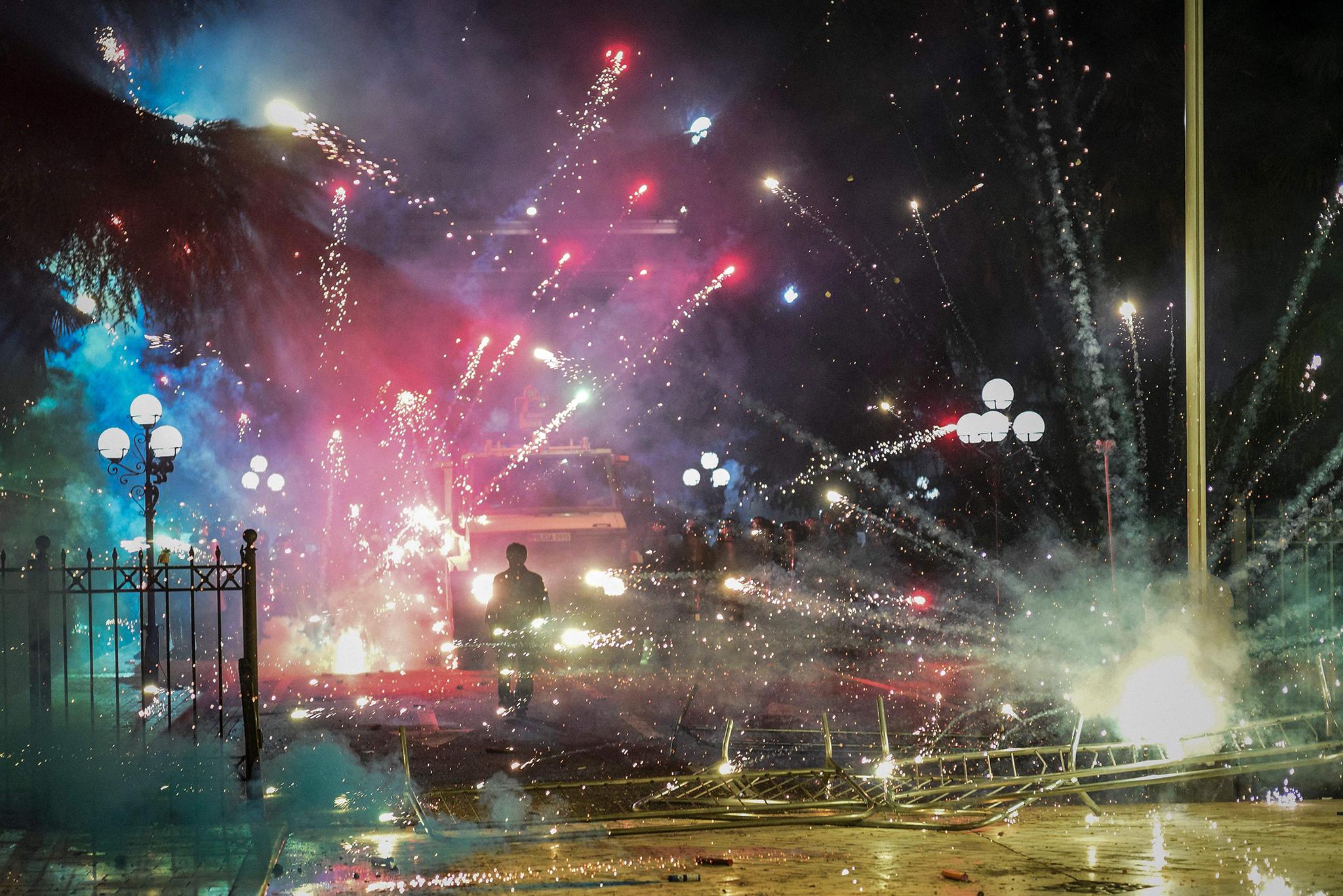 Protests against the government in Albania turned violent on Sunday when some protesters began throwing firecrackers and other projectiles.