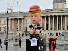 Giant model of Trump on golden toilet tweeting appears in London