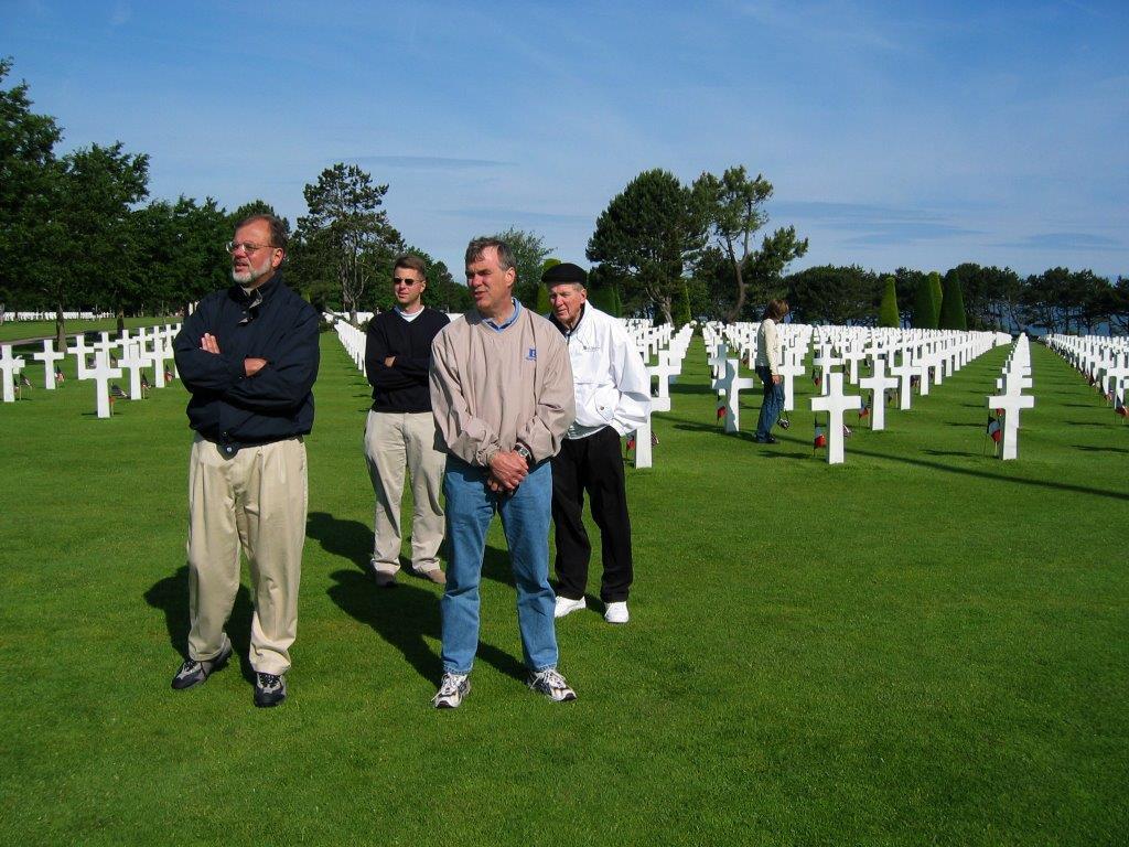 From left, Bill Svrluga Jr, Barry Svrluga, Dick Svrluga and Bill Svrluga Sr at the Normandy American Cemetery and Memorial on 6 June 2003