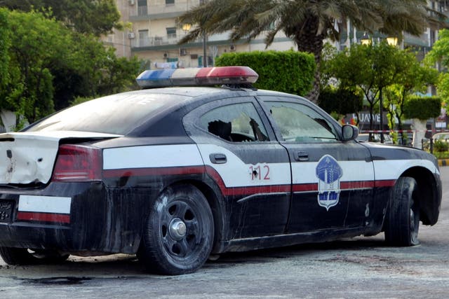 A damaged police car is seen at the scene where a militant attacked a security forces patrol on Monday, in Lebanon's northern city of Tripoli, Lebanon June 4, 2019